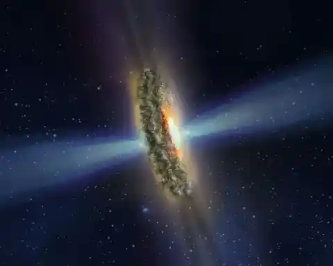 Imagen 1 de Un láser cósmico del tamaño de una galaxia lleva 8.000 millones de años disparando hacia la Tierra: es el más potente jamás visto